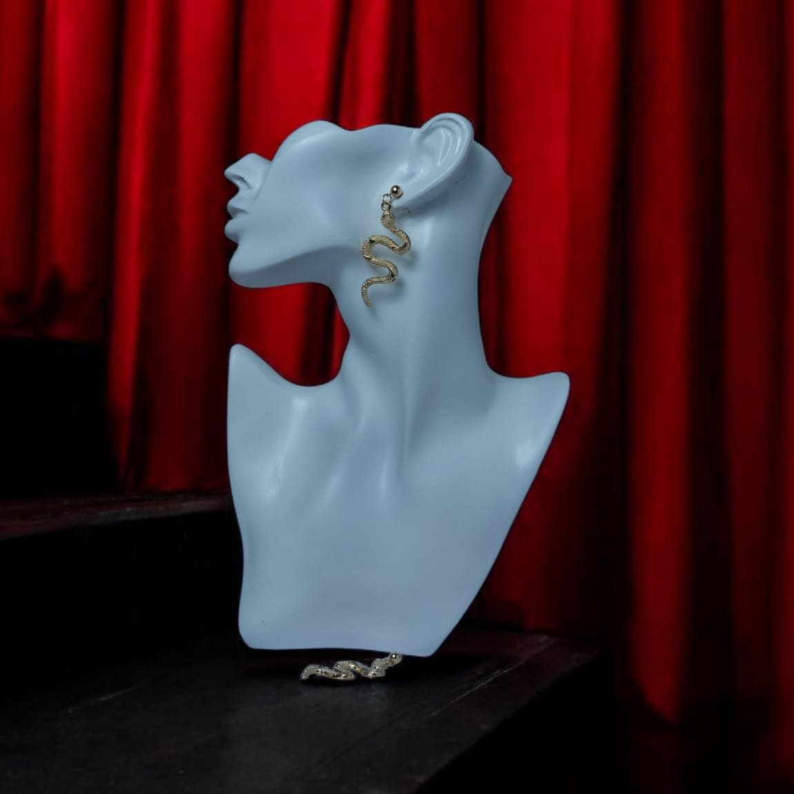 Golden serpent earring